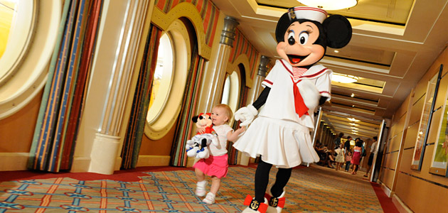 Young guest with Minnie onboard Disney Magic.