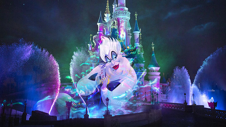 Ursula from the Little Mermaid projected on Sleeping Beauty Castle