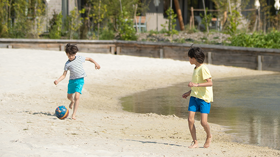 Young guests playing in the sand at Les Villages Nature Paris