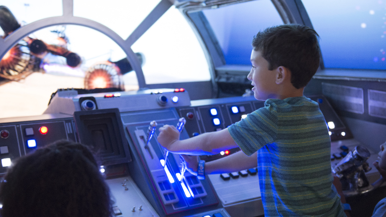 Young guest playing on the Millennium Falcon