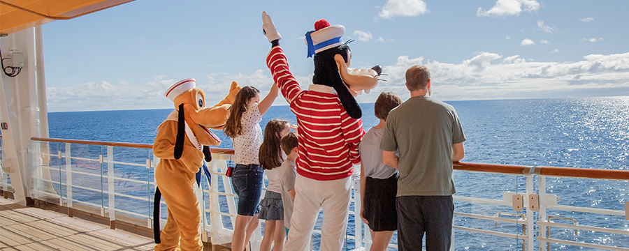 Pluto and Goofy welcome Guests aboard Disney Cruise Line