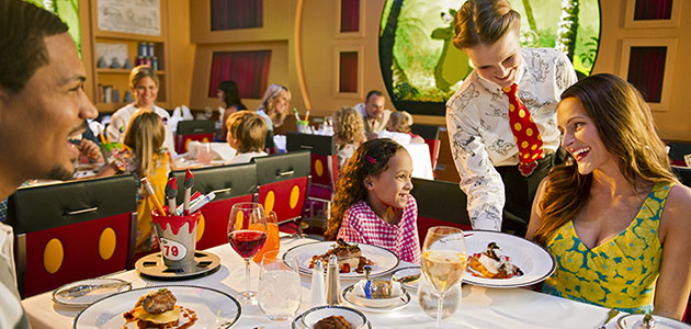Family dining at Animator's Palate onboard Disney Dream.