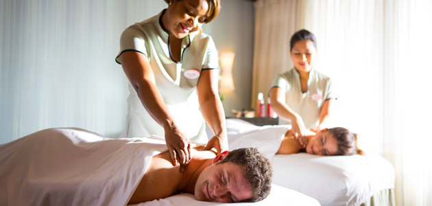 Couple enjoying a therapeutic massage treatment at Senses Spa & Salon