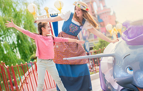 Young guest pretending to fly on Dumbo