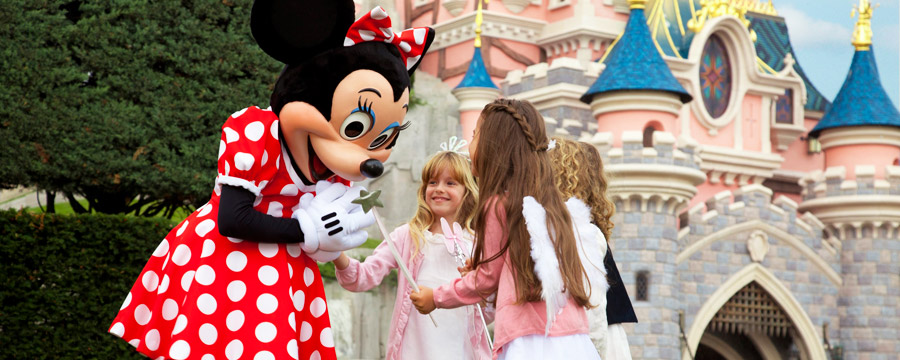 Minnie and girls in front of Sleeping Beauty Castle