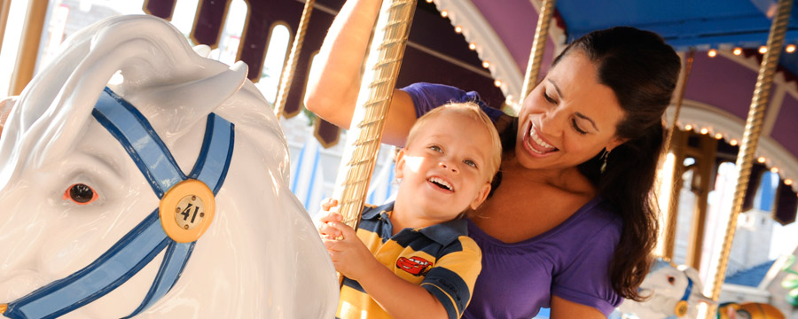 Mother and son on Cinderella's Golden Carousel