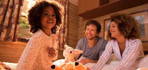 Family in a self-catering cabin at Disney Davy Crockett Ranch