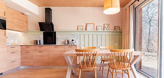 Kitchen and dining area in Les Villages Nature Paris apartment