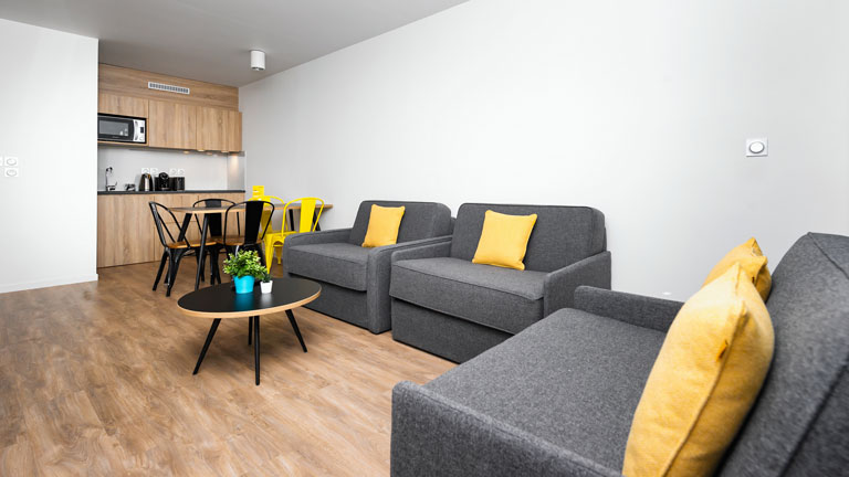 Kitchen and dining room in a Staycity Aparthotels Paris, Marne-La-Vallée apartment.