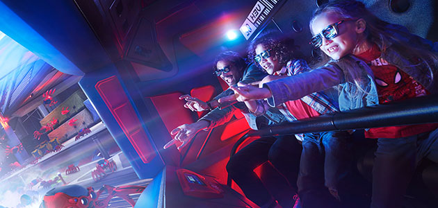 A family joins Spider-man on an interactive attraction wearing 3D glasses