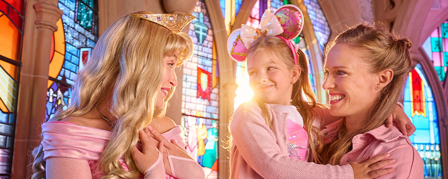Young girl with her mum meeting Sleeping Beauty