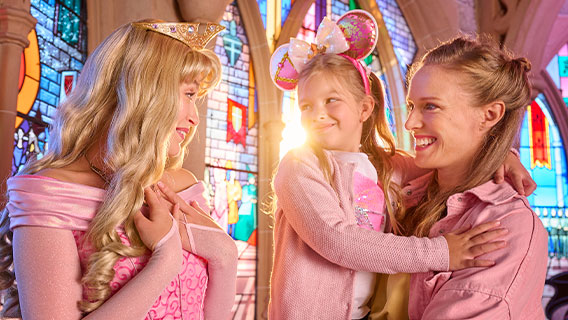 Young girl with her mum meeting Sleeping Beauty