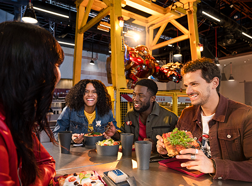 Friends dining at Stark Factory in Marvel Avengers Campus