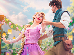 Tangled's Rapunzel and Flynn dancing in Disneyland Park