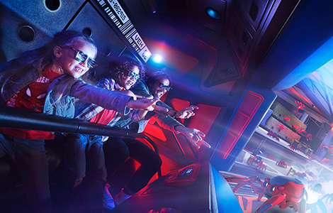 A family joins spider man on an interactive attraction wearing 3D glasses.jpg