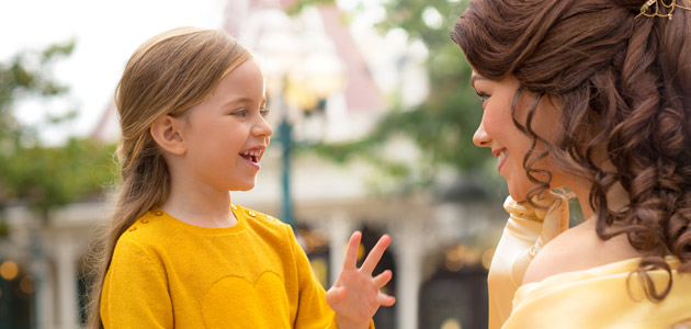 Young guest meets Belle in the Princess Pavillion.