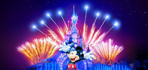 Disney Illuminations fireworks with a Mickey Mouse projection over Sleeping Beauty’s Castle
