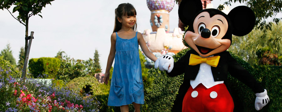 Mickey and young Guest at Disneyland Paris