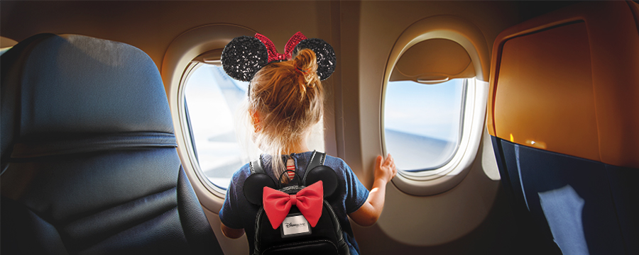Young child flying to Disneyland Paris