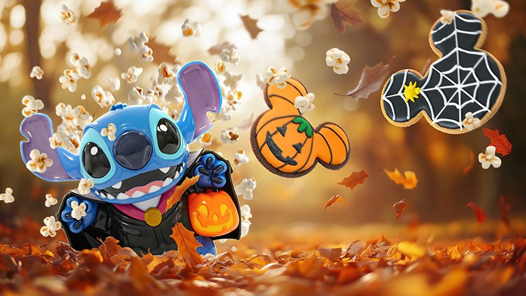An array of Halloween treats from Disney Halloween Festival, displayed among autumnal leaves