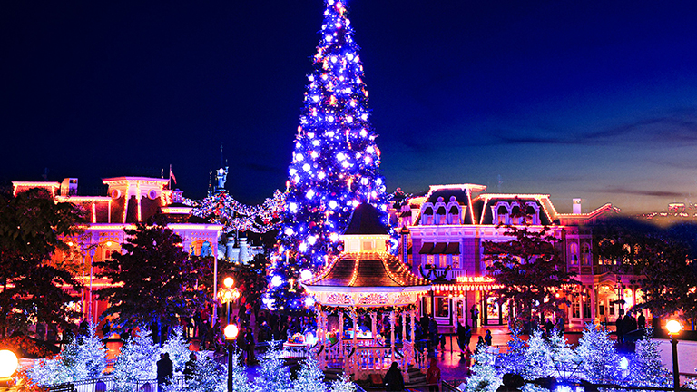 Giant Christmas tree lights up at Disneyland Paris at night