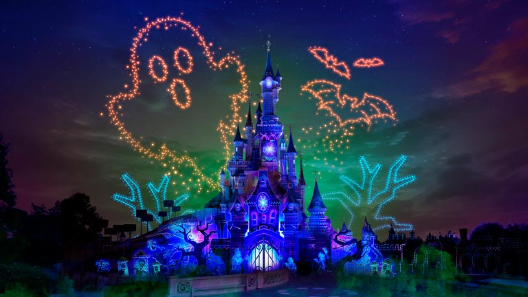 Disney Electrical Sky Parade lights up the night sky above Sleeping Beauty's Castle