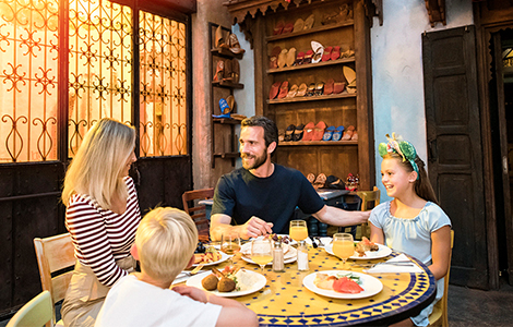 Family dining with Disney Princesses at Auberge de Cendrillon in Disneyland Park