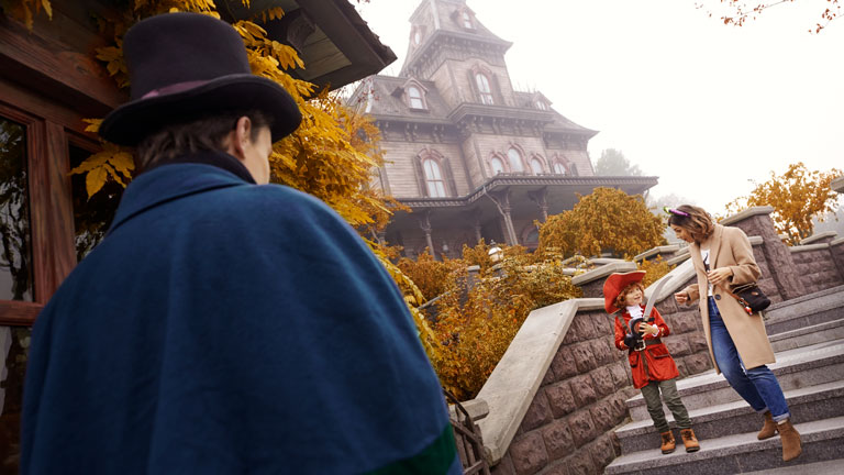 Guests entering Phantom Manor attraction