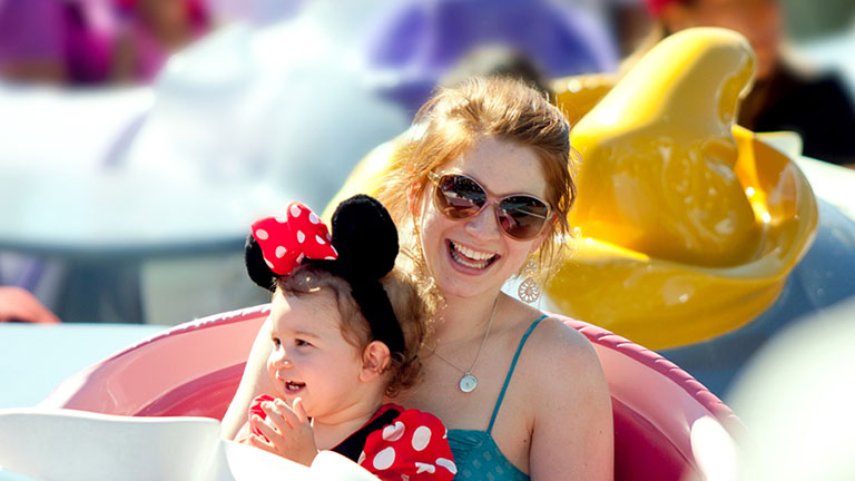 Mum and child on Dumbo the Flying Elephant