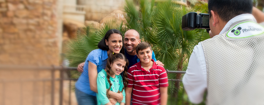 Family having their photo taken by a Disney PhotoPass Photographer