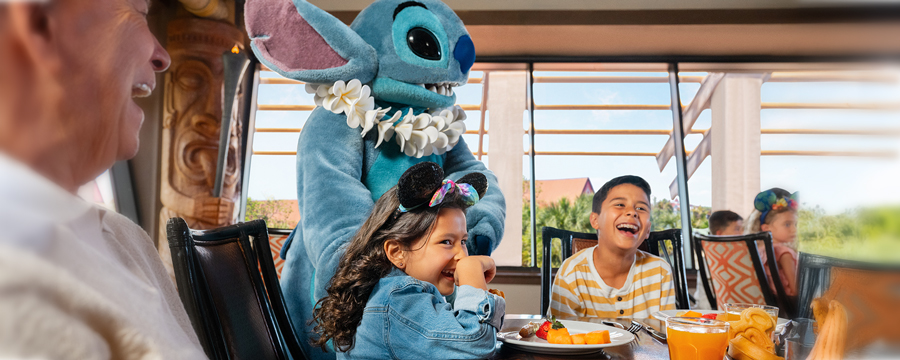 Mother and daughter with Pluto at Chef Mickey's