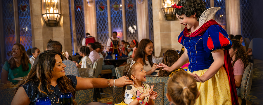 Family with young kids enjoying deluxe table service dining plan