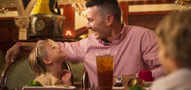 Family enjoying a meal at Be Our Guest Restaurant in Magic Kingdom