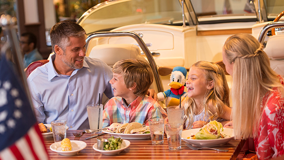 Guests enjoying a luxury family meal at The Boathouse, Disney Springs
