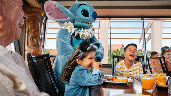 Family enjoying table service dining plan with Stich