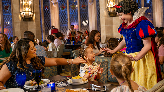 Family with young kids enjoying deluxe-table service dining plan