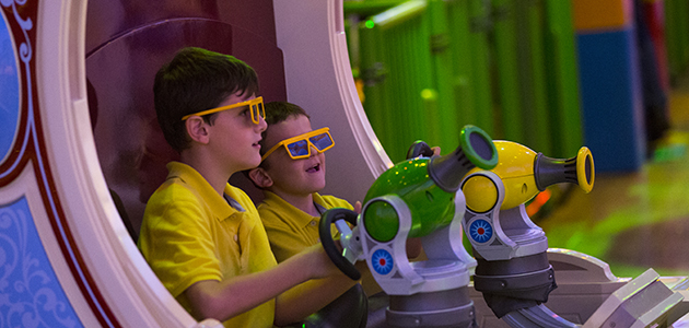 Two young boys enjoying Toy Story Mania! at Disney's Hollywood Studios.