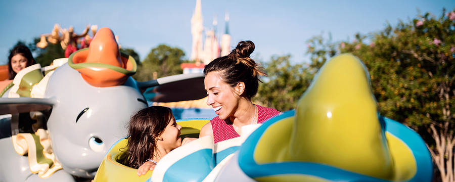 Young guest with mum on Dumbo The Flying Elephant