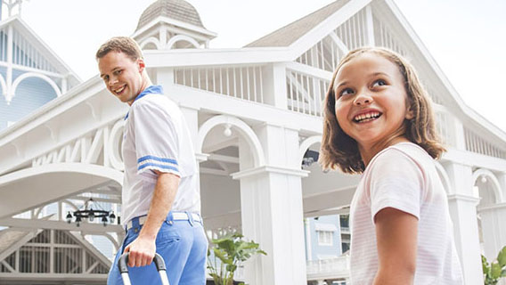 Young guest with Cast Member at Disney's Beach Club Resort