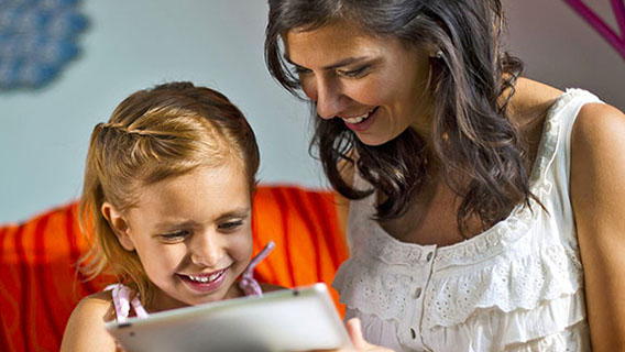 Mother and daughter planning their Disney holiday