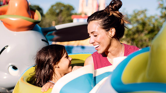 Young guest with mum on Dumbo The Flying Elephant