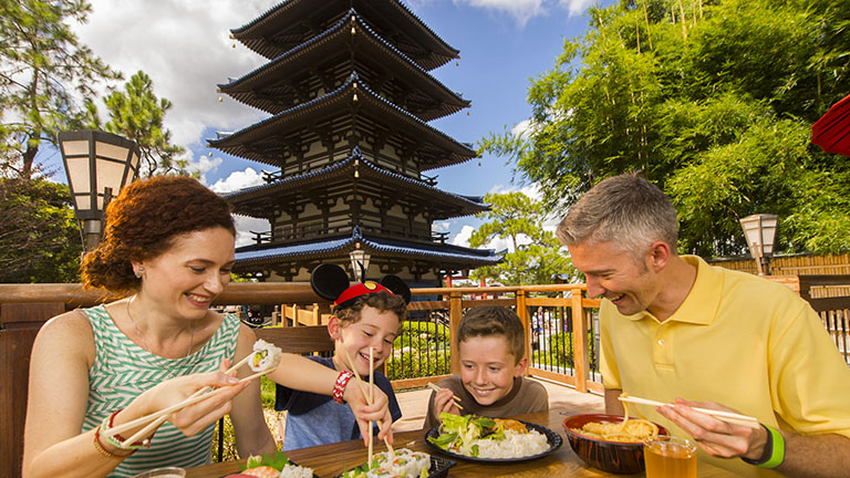 Family enjoying sushi at Epcot's World Showcase, Japan