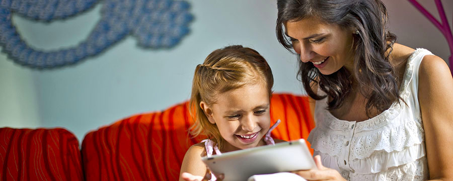 Mother and daughter planning their Disney holiday