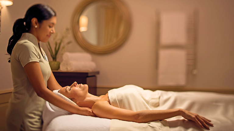 Guest enjoying a massage at Senses in Disney's Grand Floridian Resort and Spa