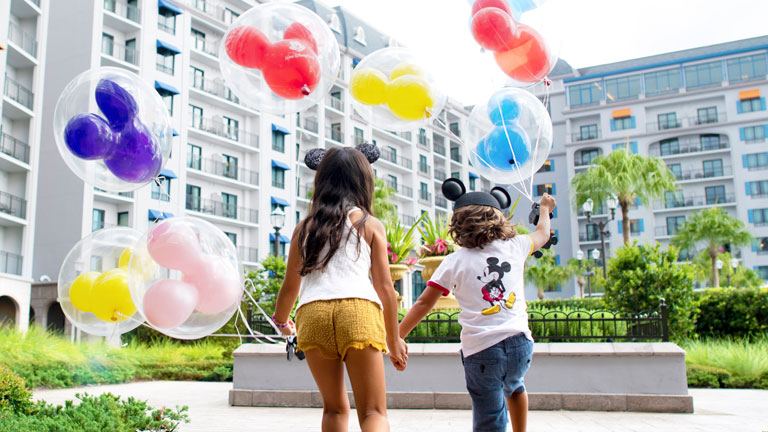 Guests with balloons at Disney's Riviera Resort