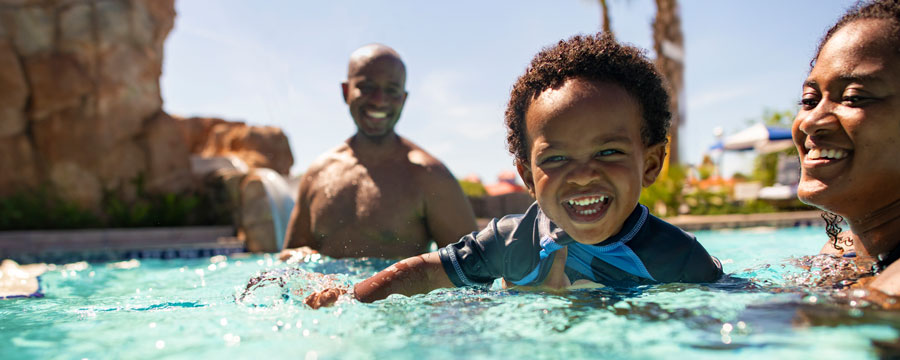 Family in pool at Disney's Riviera Resort