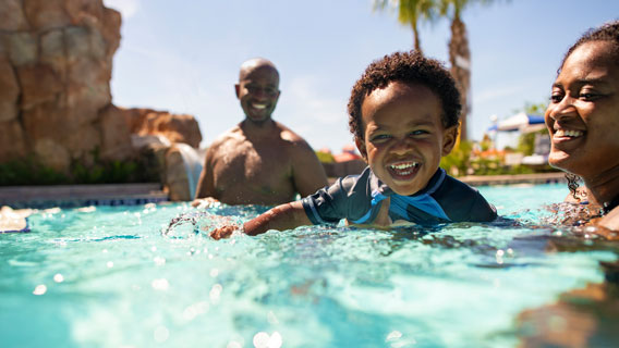Family in pool at Disney's Riviera Resort