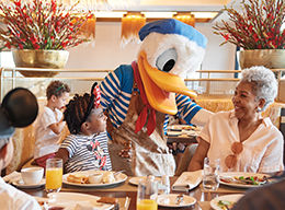 Guests dining with Donald Duck
