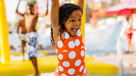 Little girl enjoying the watery fun at Blizzard Beach