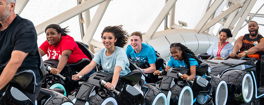 Teens racing on Tron Lightcycle